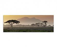 Wandbild auf Leinwand als Panorama in 120x40 cm Afrika bei Sonnenuntergang! Afrikanische Savanne mit Baum und Berge.Serengeti mit Graslandschaft.
